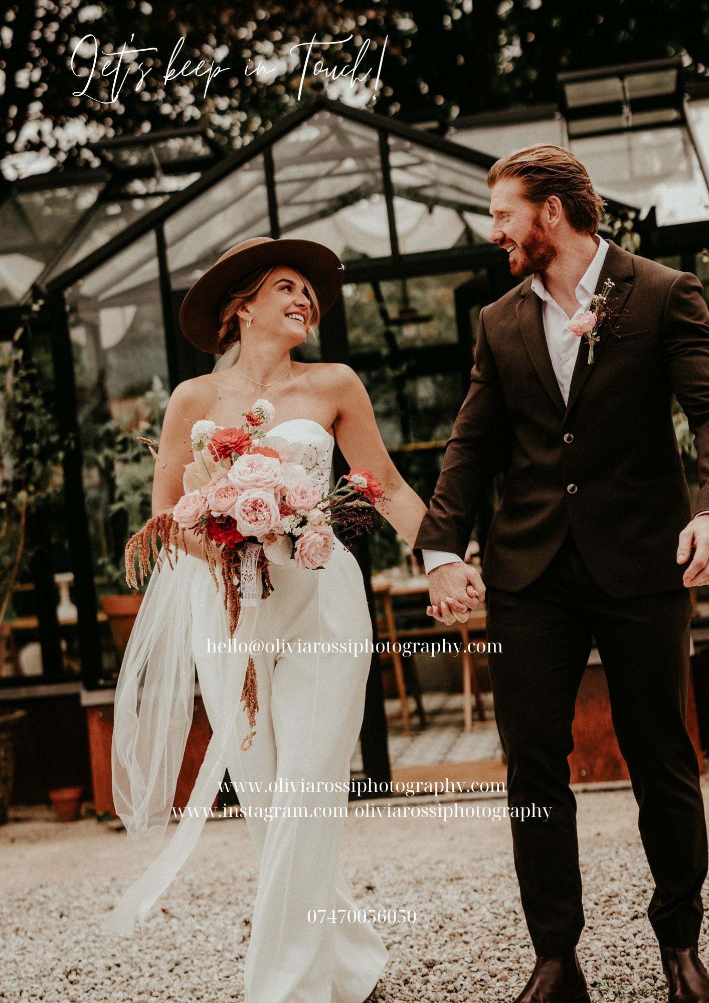 A couple in wedding attire share a joyful moment together outside a greenhouse with pink floral bouquet.