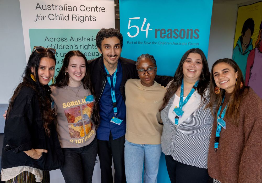 Six people smiling together