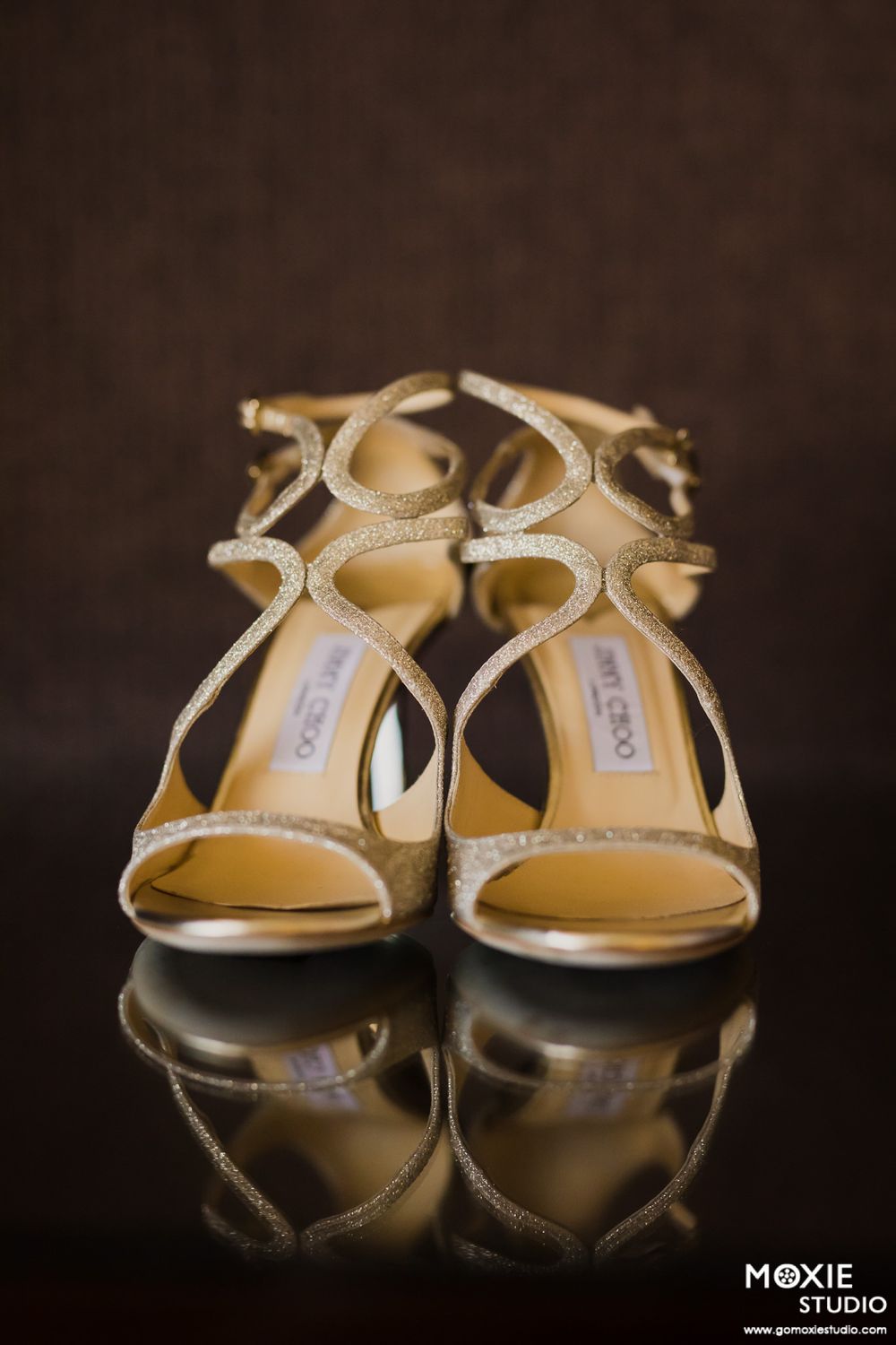 Elegant gold and silver bridal sandals arranged in artistic detail shots against dark background.