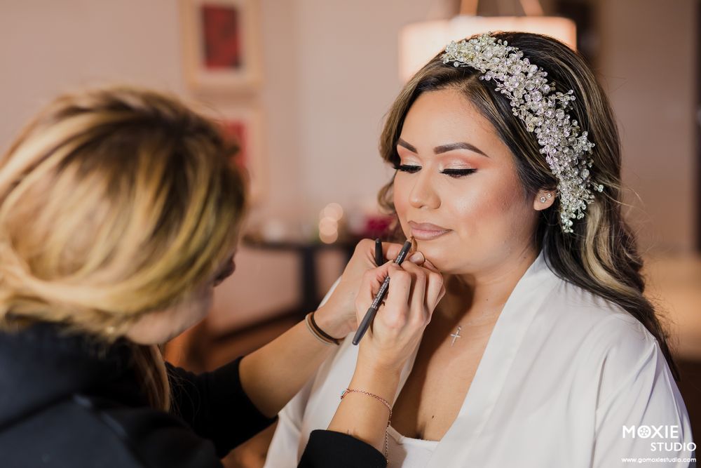 Emotional wedding moment captured as bride and guests share tearful reactions during ceremony.