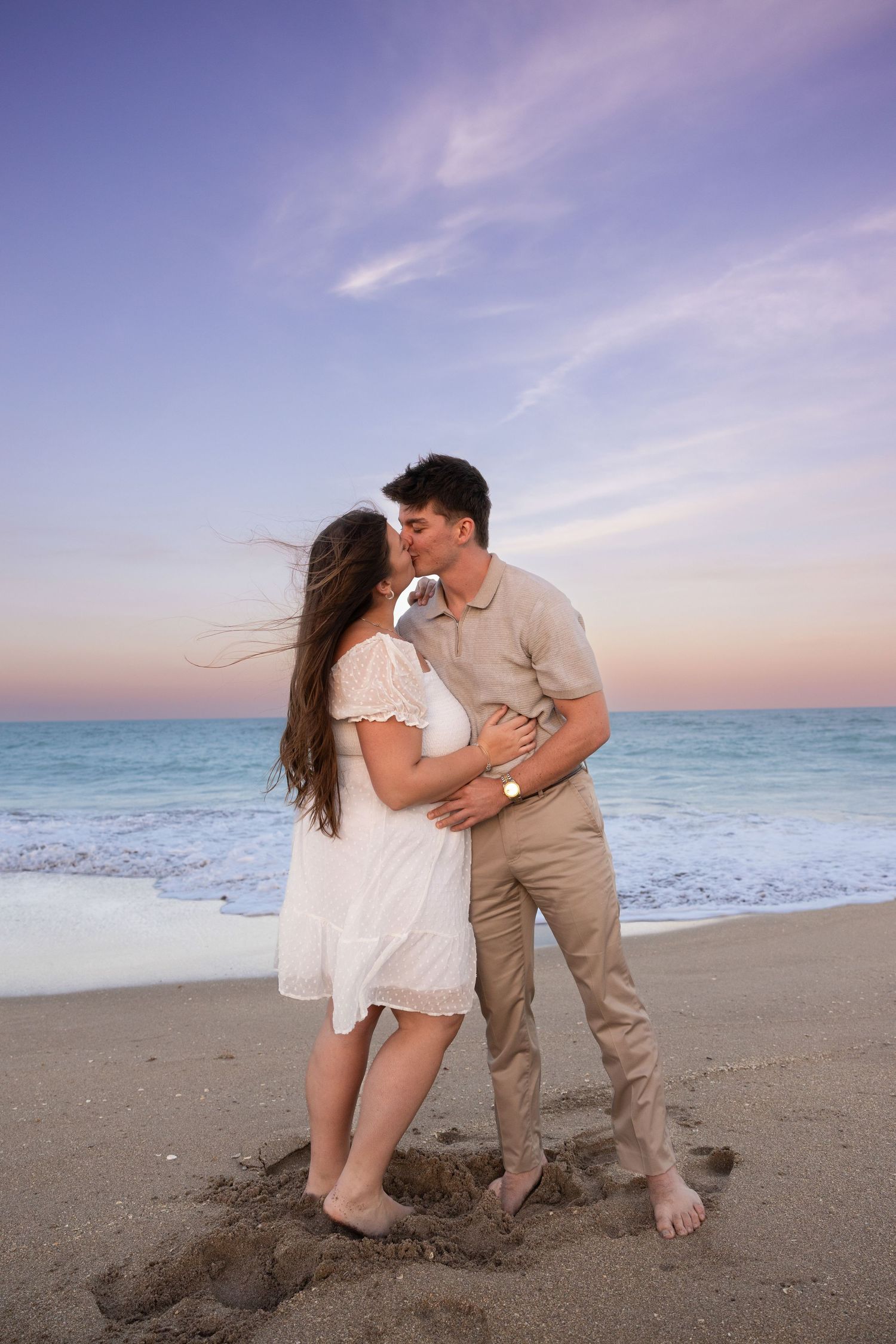 Romantic sunset and golden hour beach couples portrait on Hutchinson Island in Fort Pierce Florida perfect for vacation photo sessions