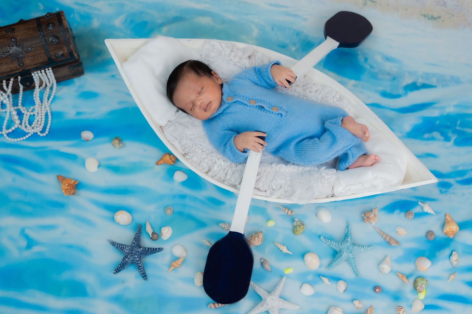 Newborn baby photoshoot in Hyderabad with ocean theme setup at baby-first studio in Manikonda