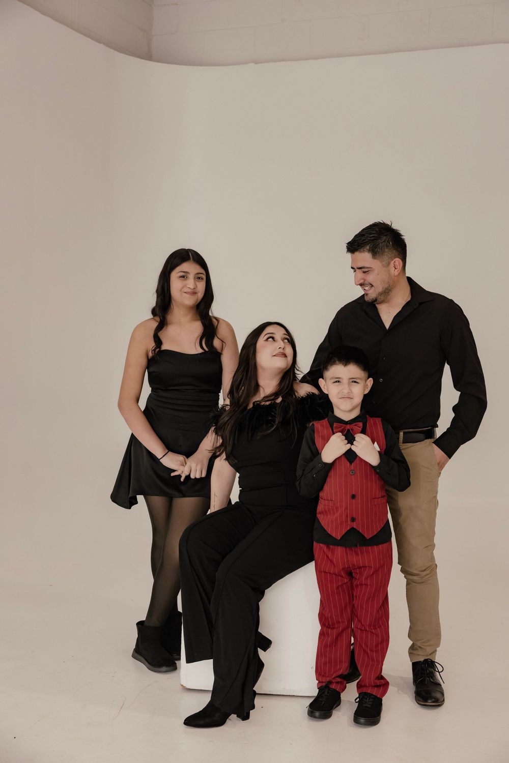 Family of 4 posing for a family photo