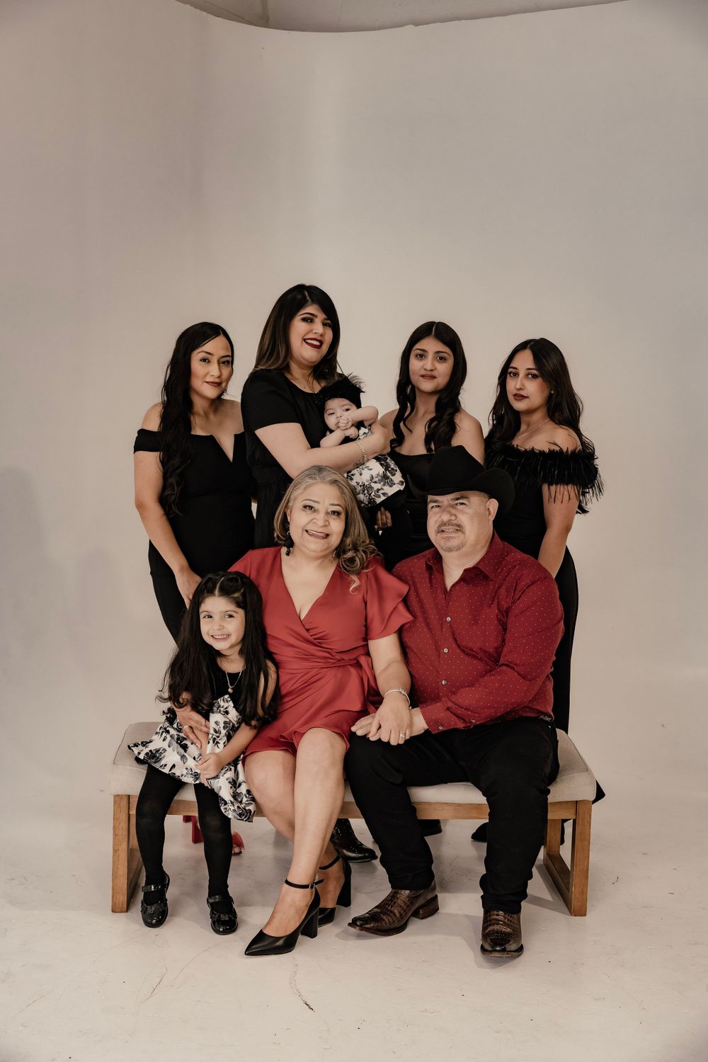 Parents, Daughters, and grandchildren posing for a family photo
