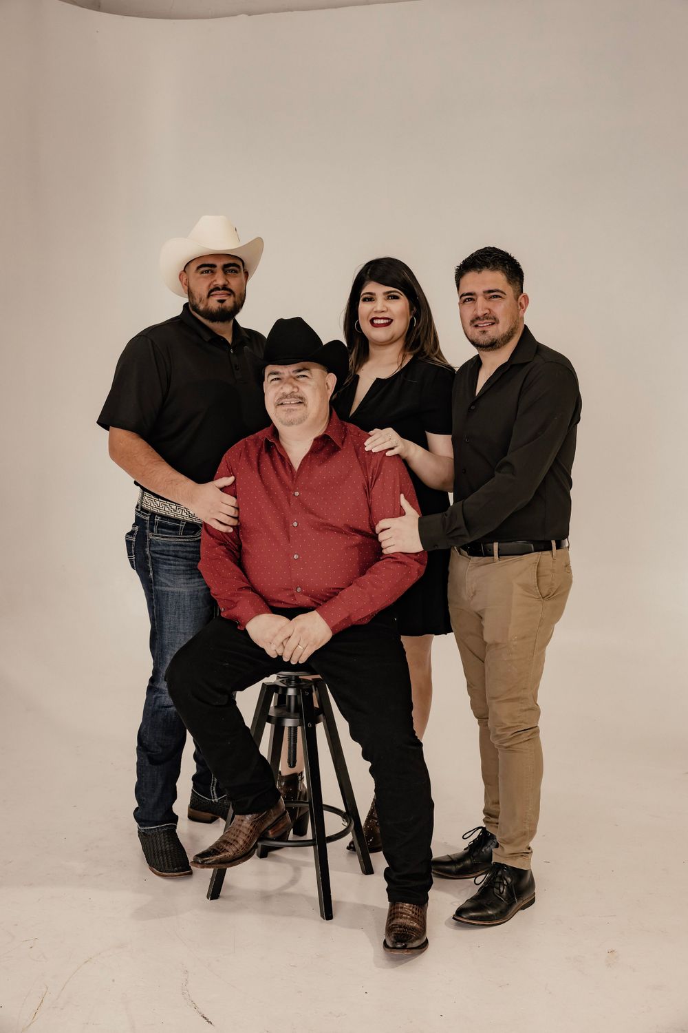 Adults posing for a family photo