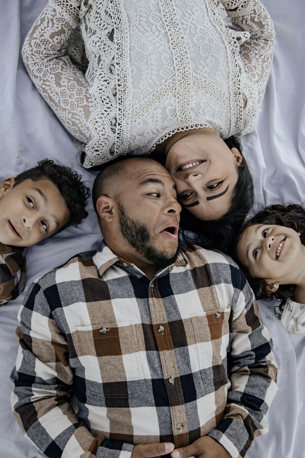 Dad being silly with his kids and wife
