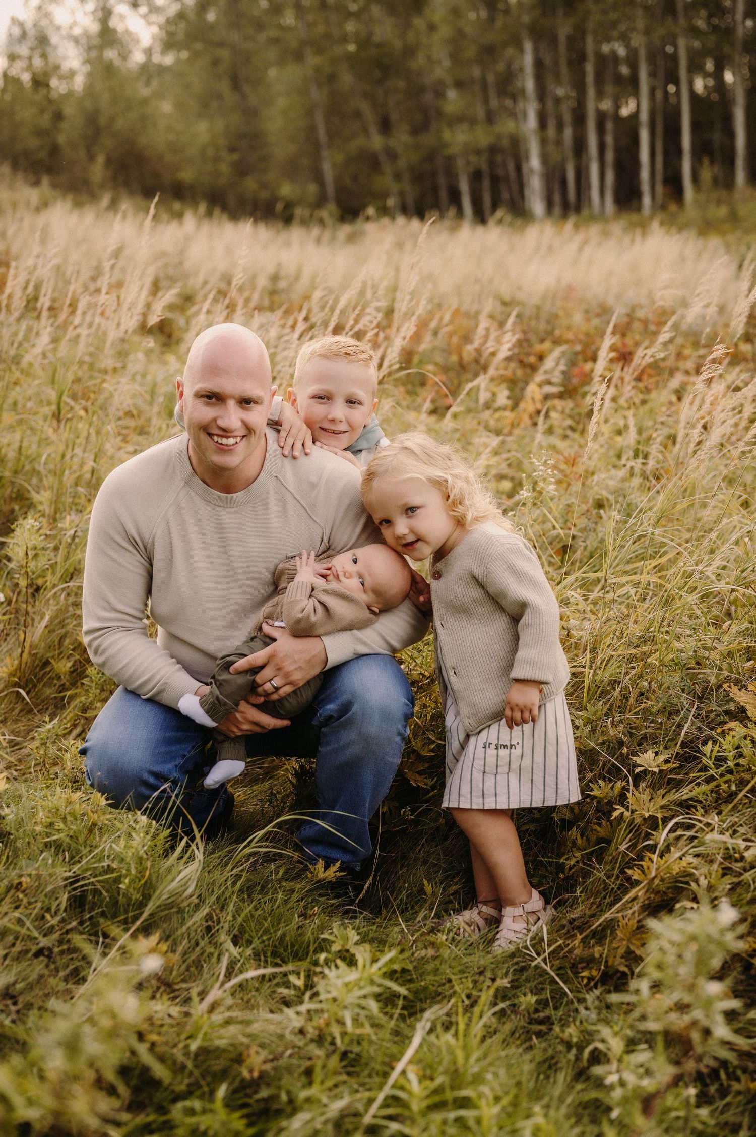 Heartwarming family moments captured in a sunlit field.