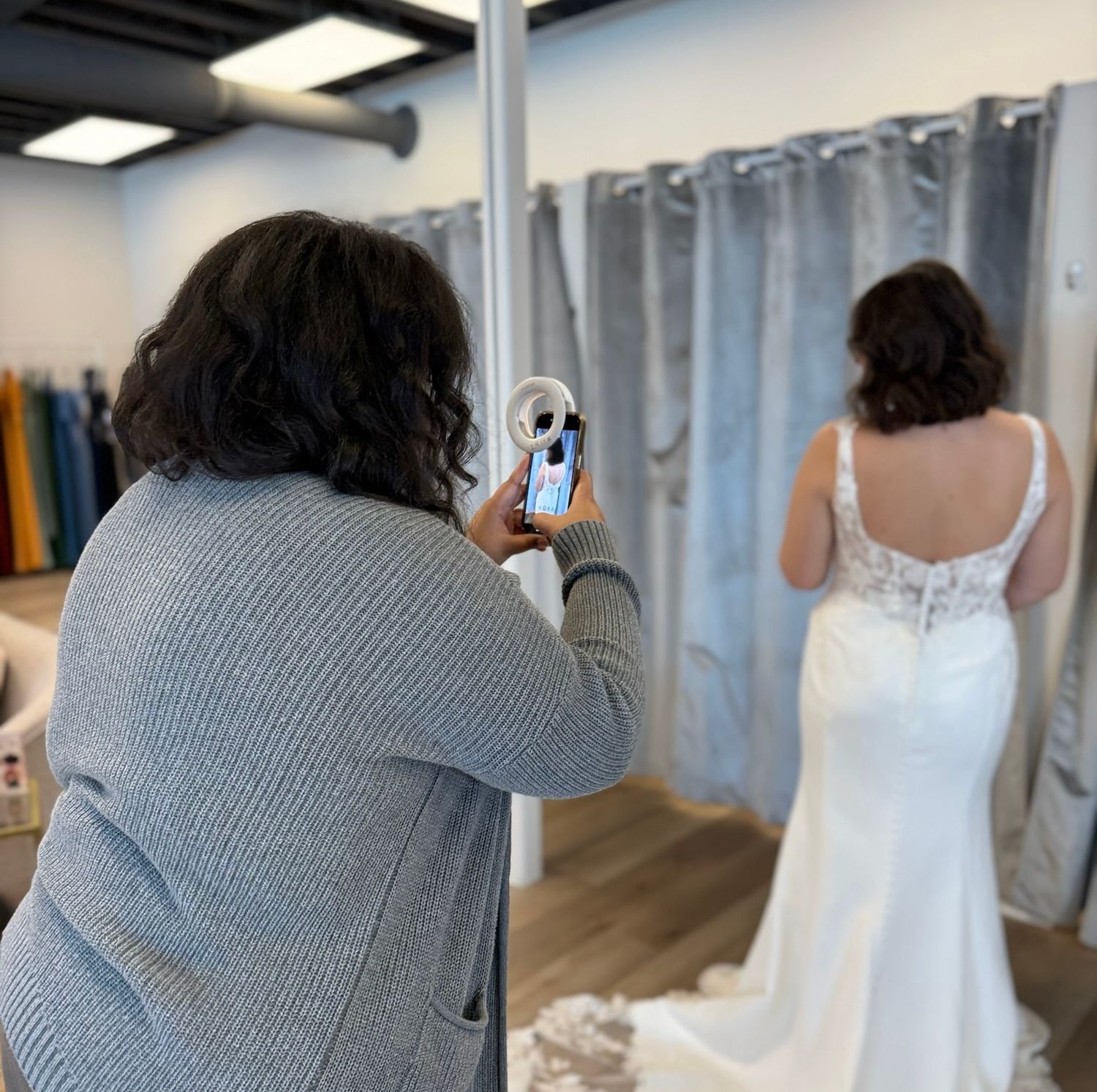 Behind the scenes of Emma Sventek taking content for her client who is a bridal store owner