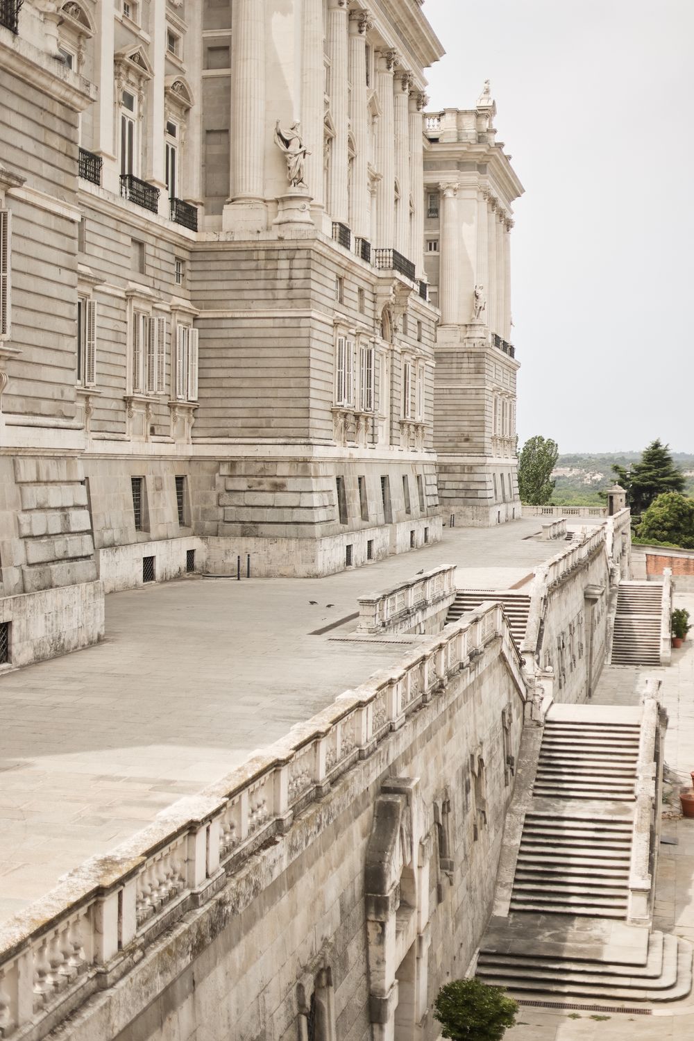 Stone staircase and architectural details of a grand neoclassical building facade shown from multiple angles.