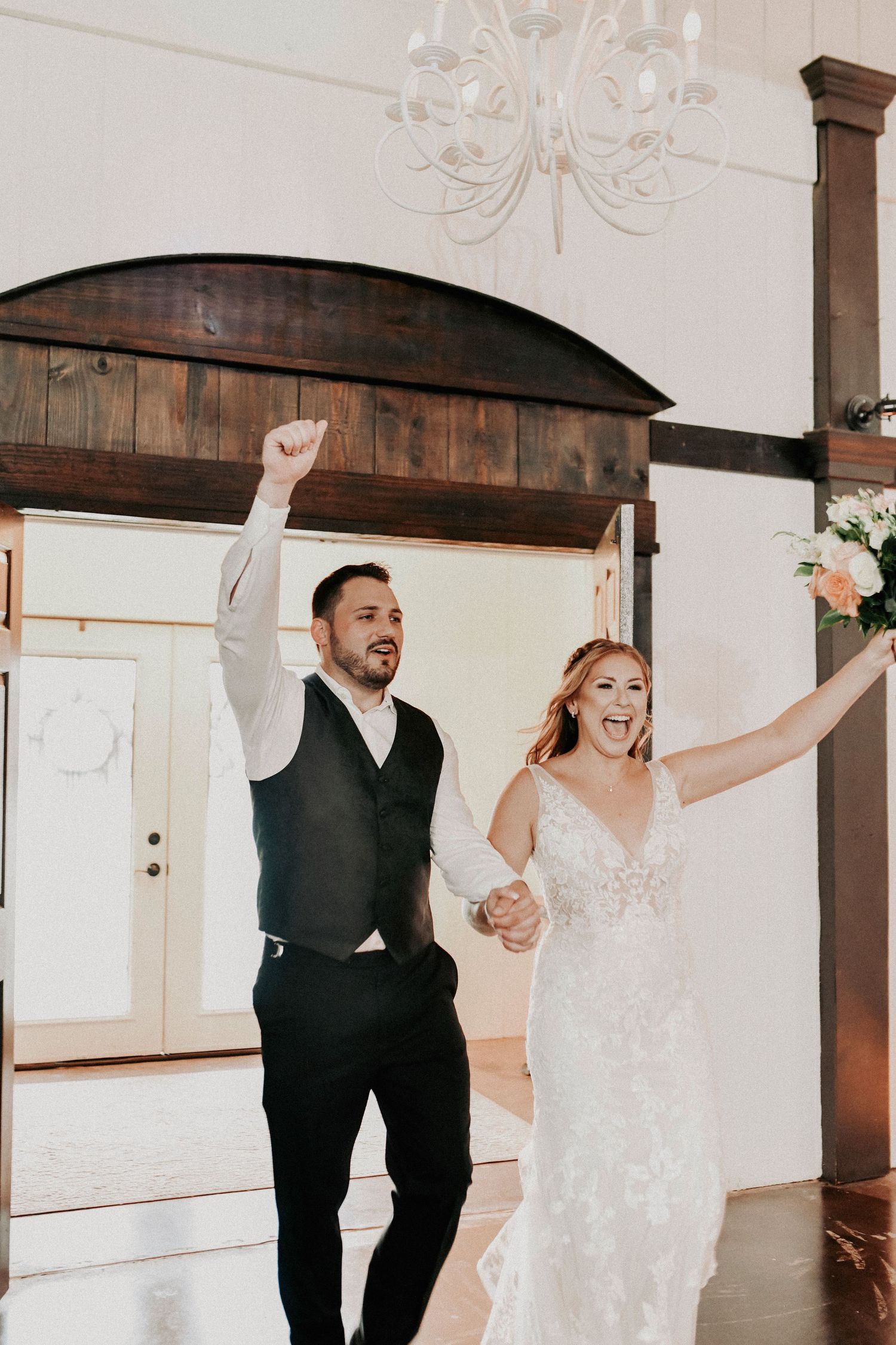 Bride and groom laughing together during an intimate moment on their spring wedding day.