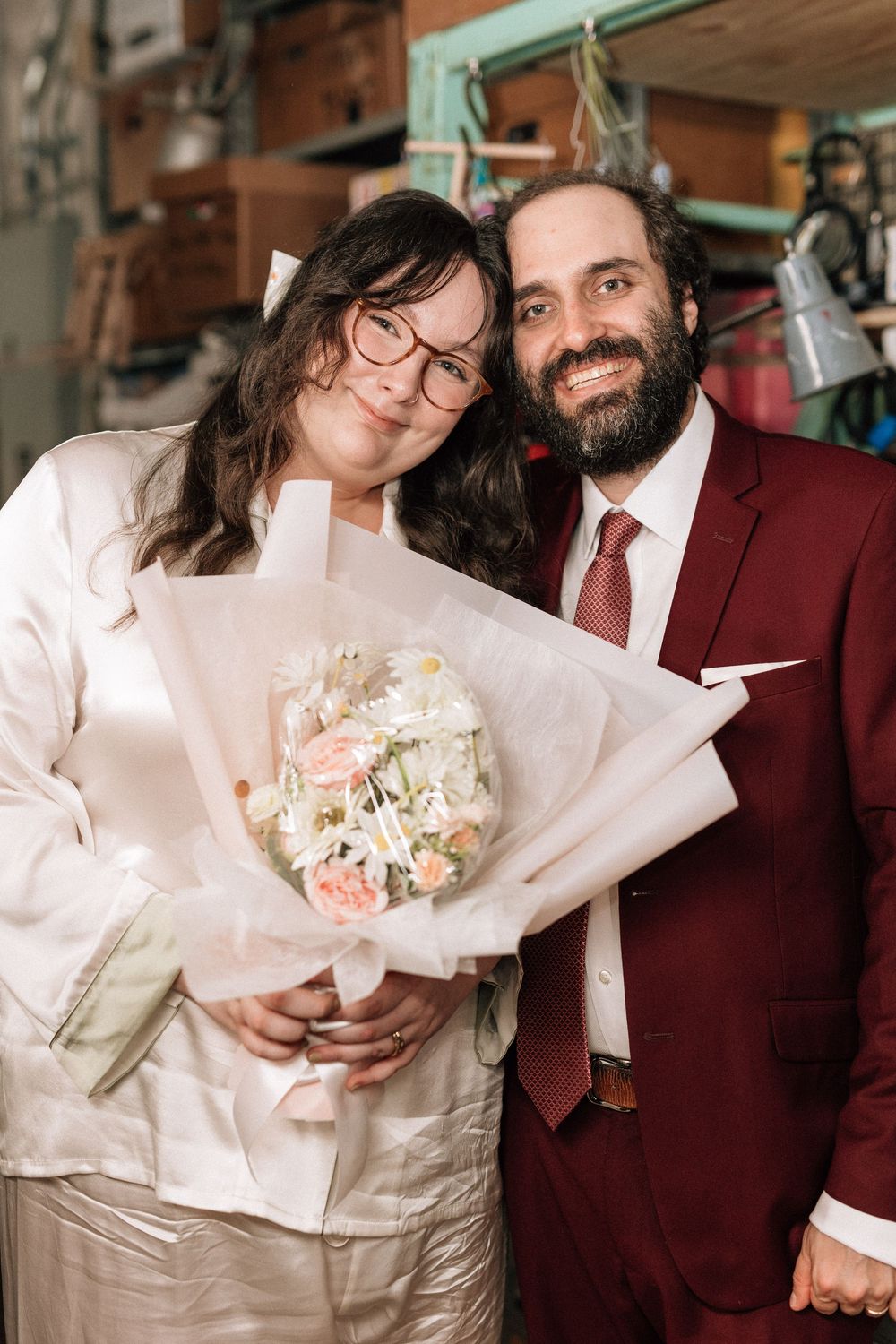 Bride and groom backstage smile for wedding photos at Bob Baker Marionette Theater Los Angeles