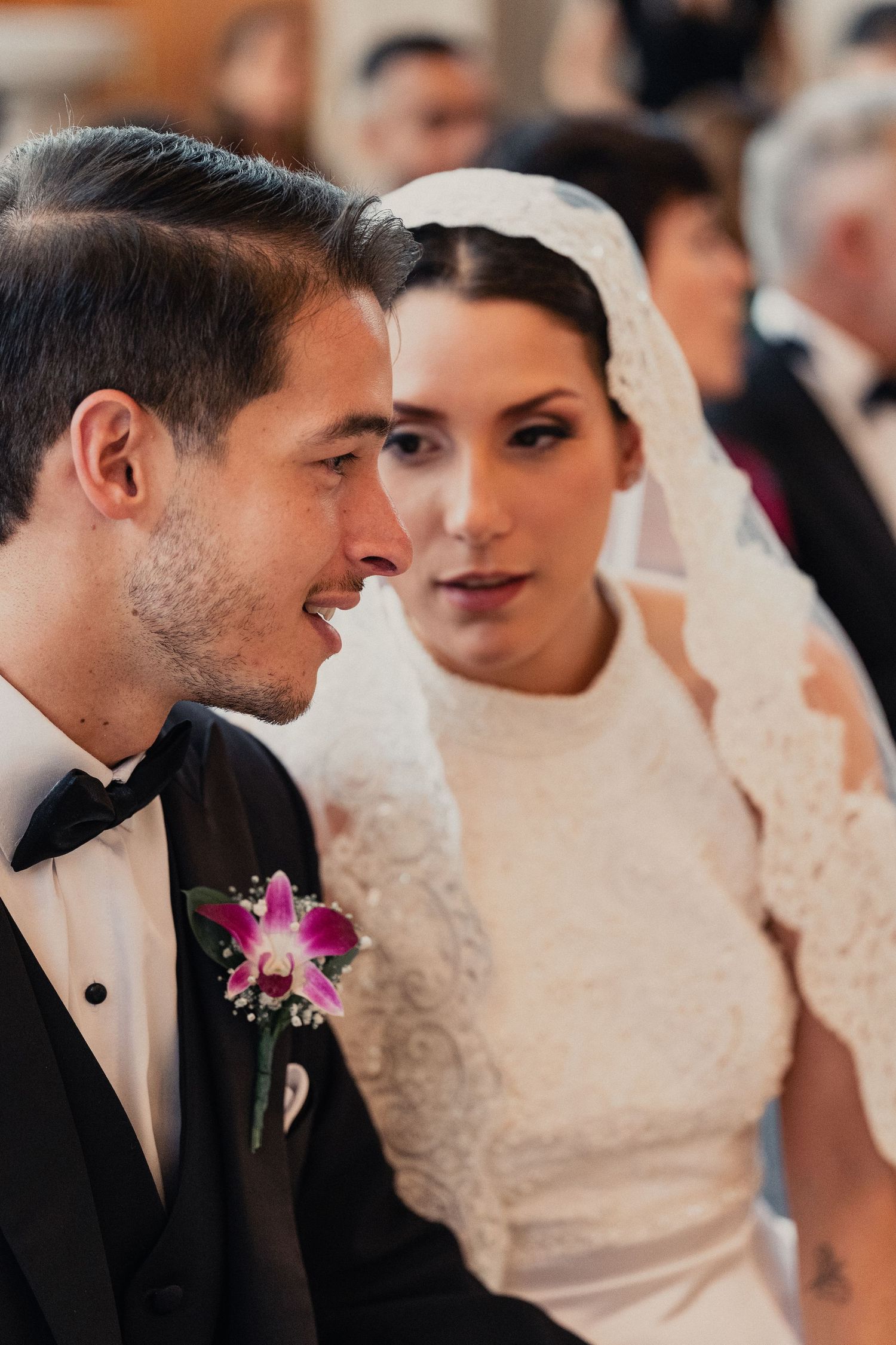 Close-up sequence of bride and groom sharing tender moments with pink orchid boutonniere.