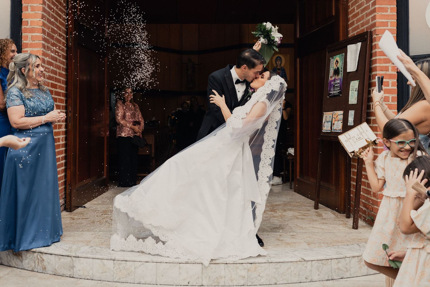 A sequence of romantic first dance moments captured at a wedding in a rustic brick venue.