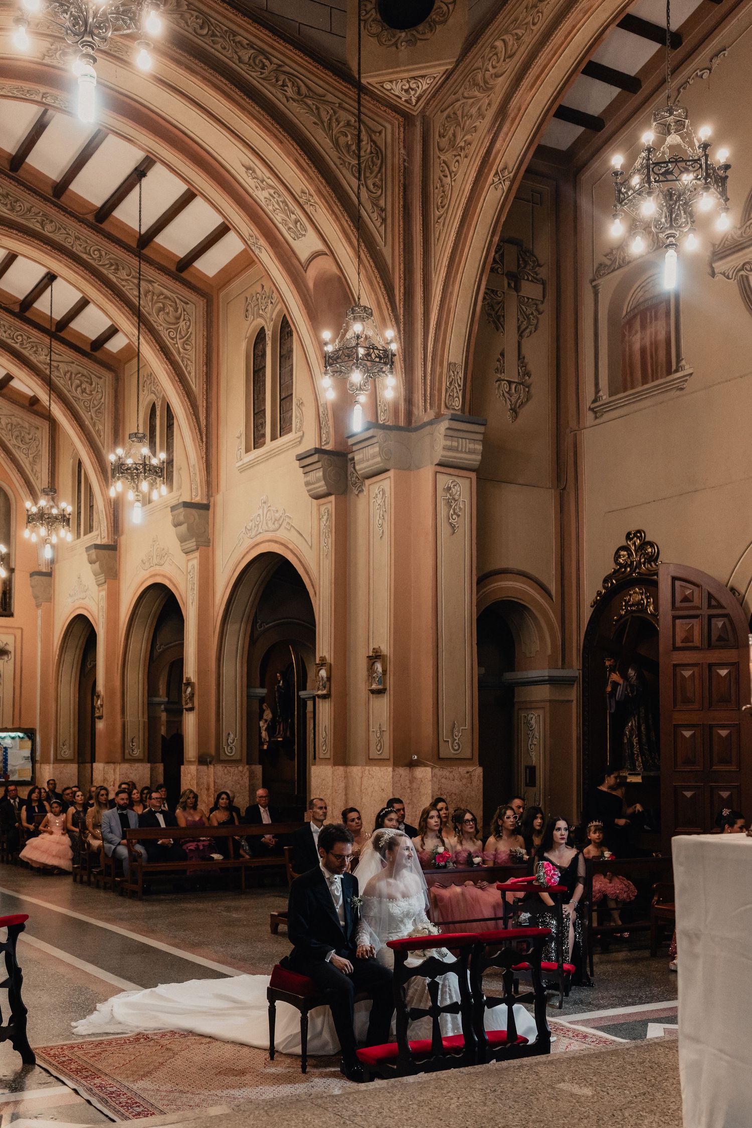 Grand cathedral-style wedding venue with ornate architecture and chandeliers.
