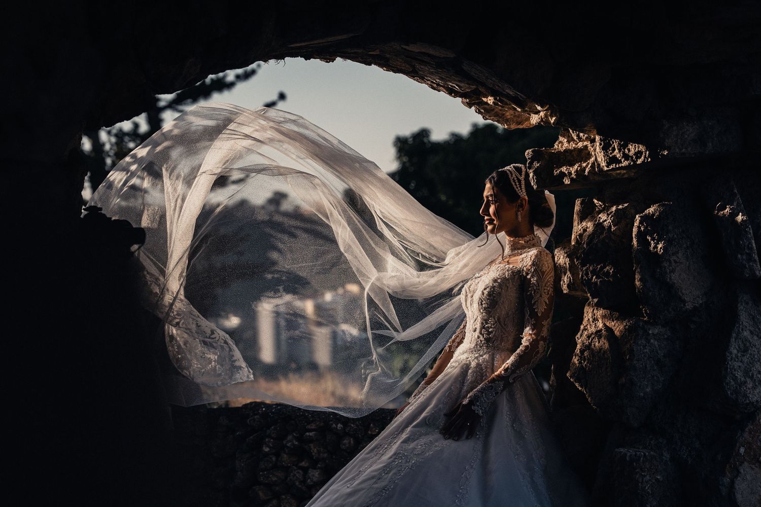 Ethereal white fabric flows gracefully against a dark background creating an artistic contrast.