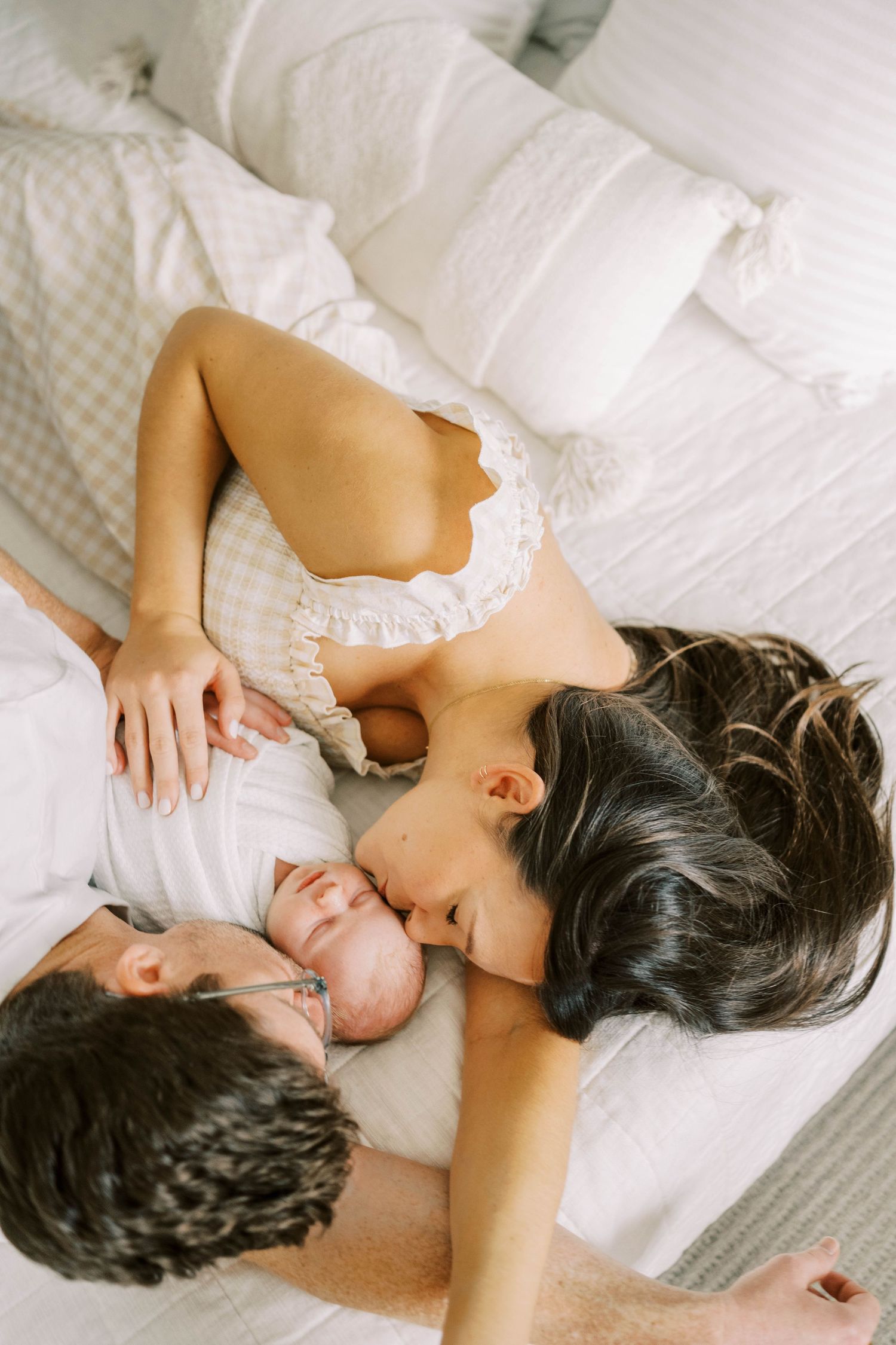 Lifestyle newborn session with parents in Frisco, Texas