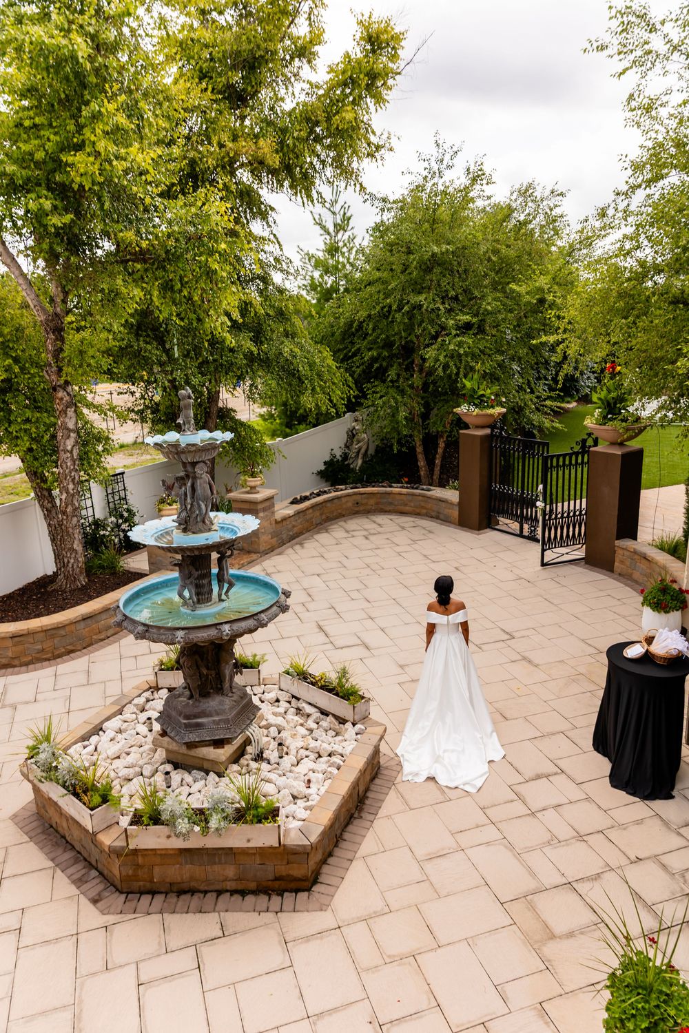 Outdoor wedding venue with stone patio and decorative water fountains at Villa Aletta in Omaha, NE.