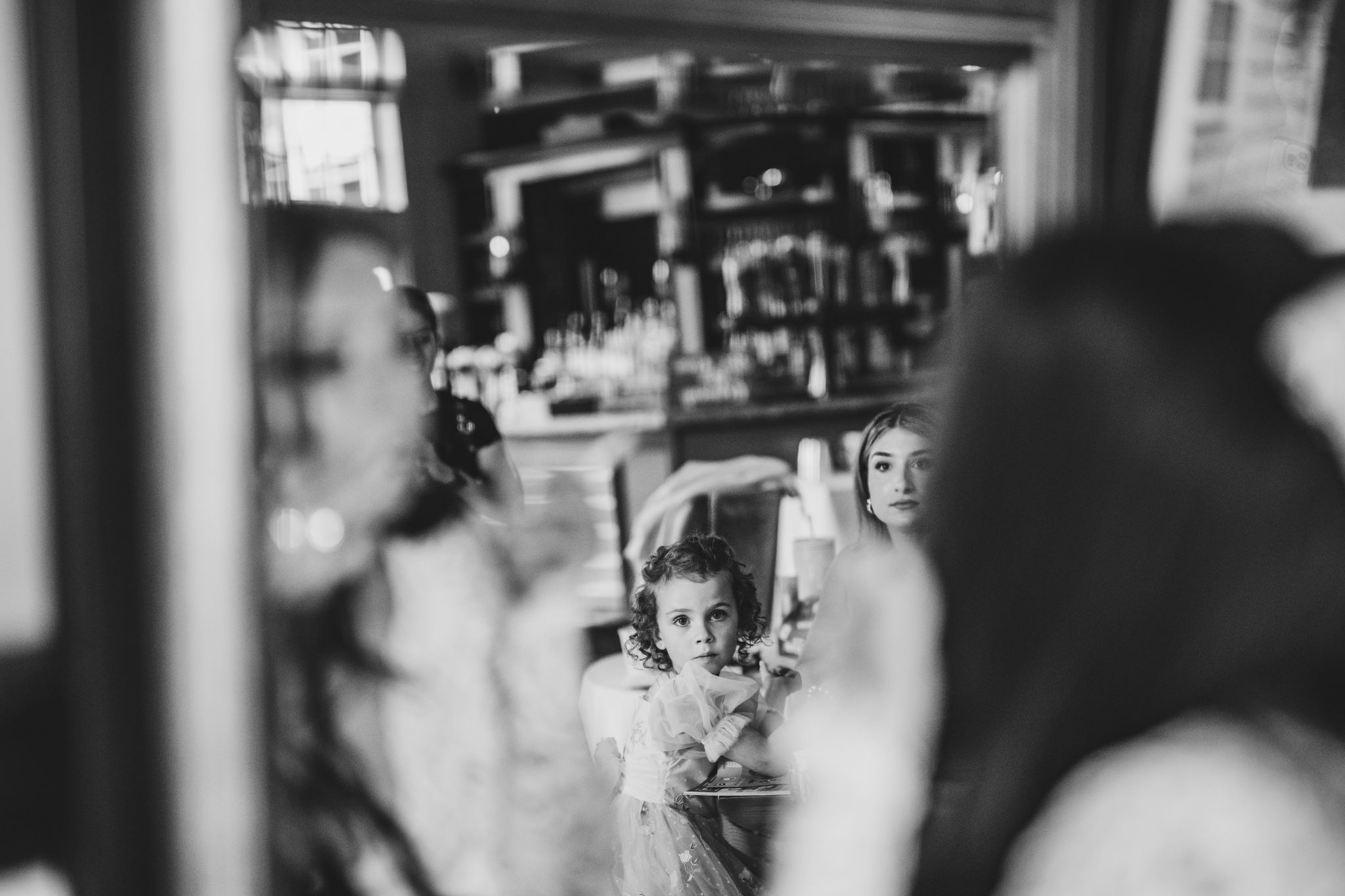 Artistic black and white wedding photography with dramatic lighting and movement.