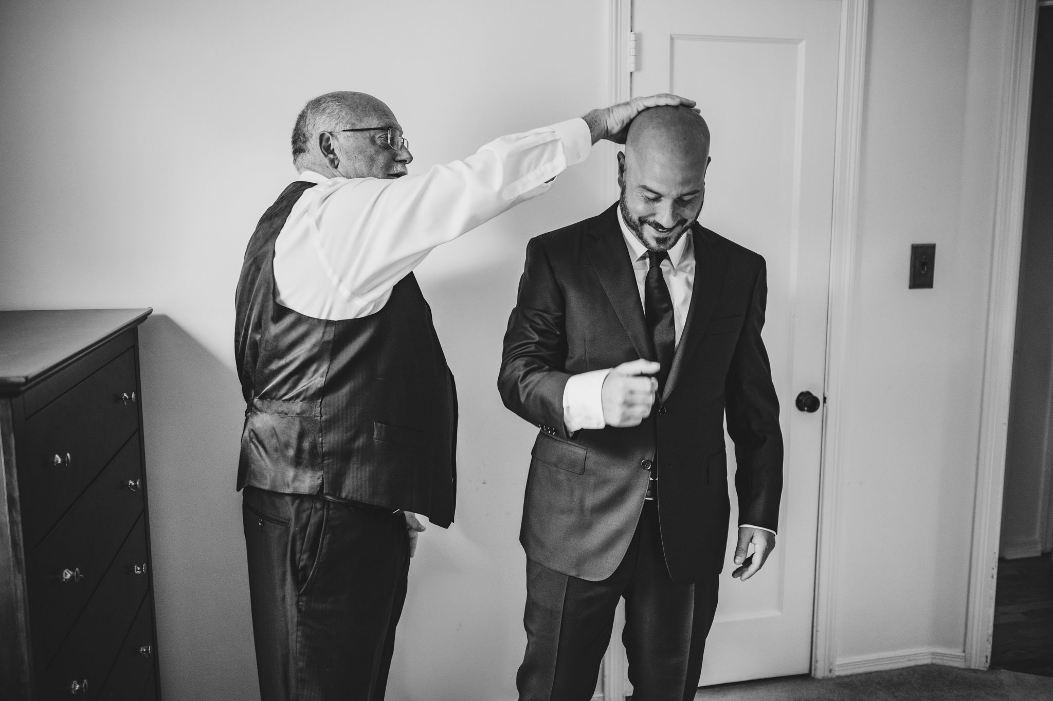 Series of candid black and white photos showing pre-wedding preparations.