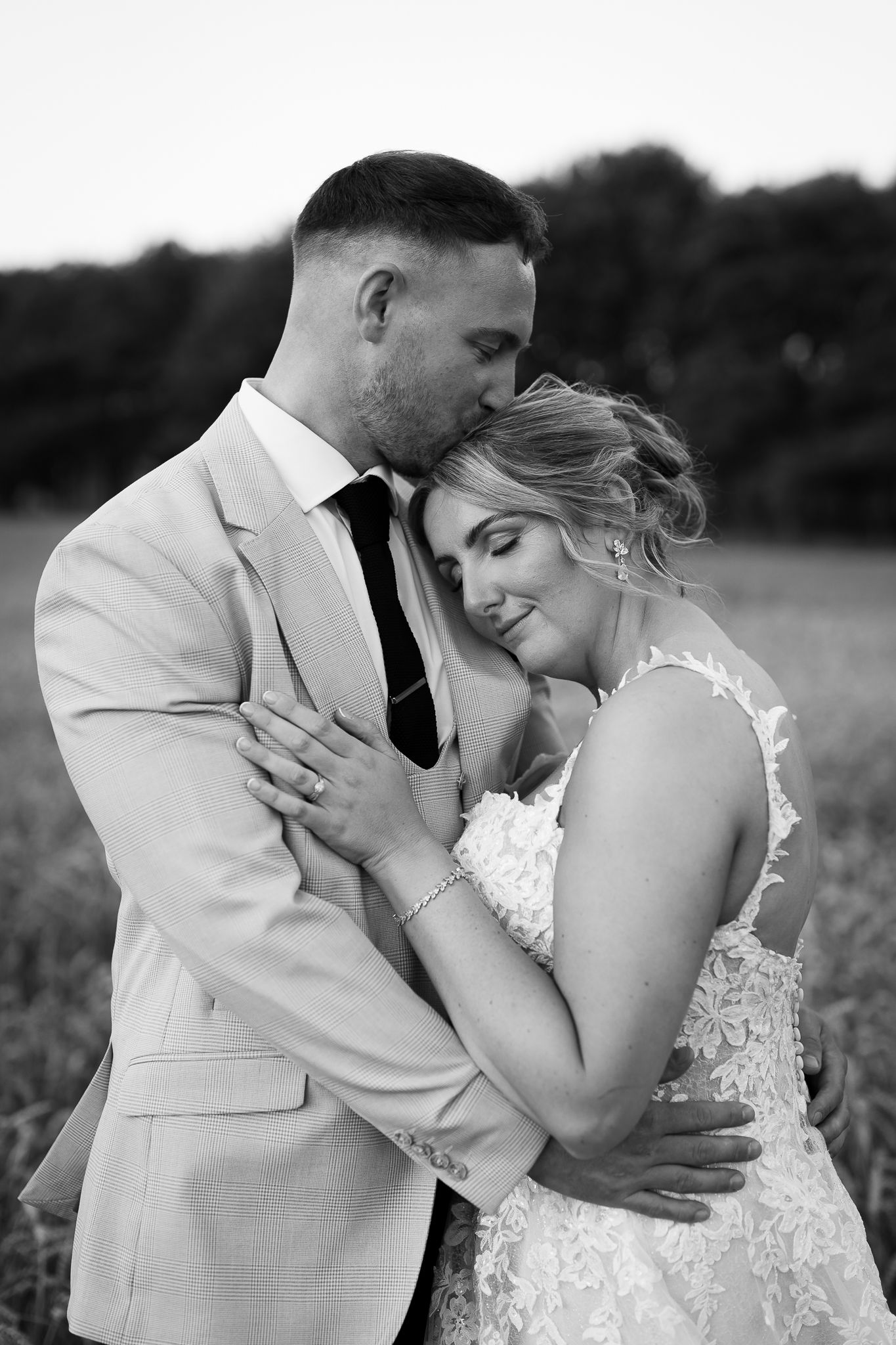 A series of intimate wedding portraits captures tender moments between newlyweds in a natural outdoor setting.