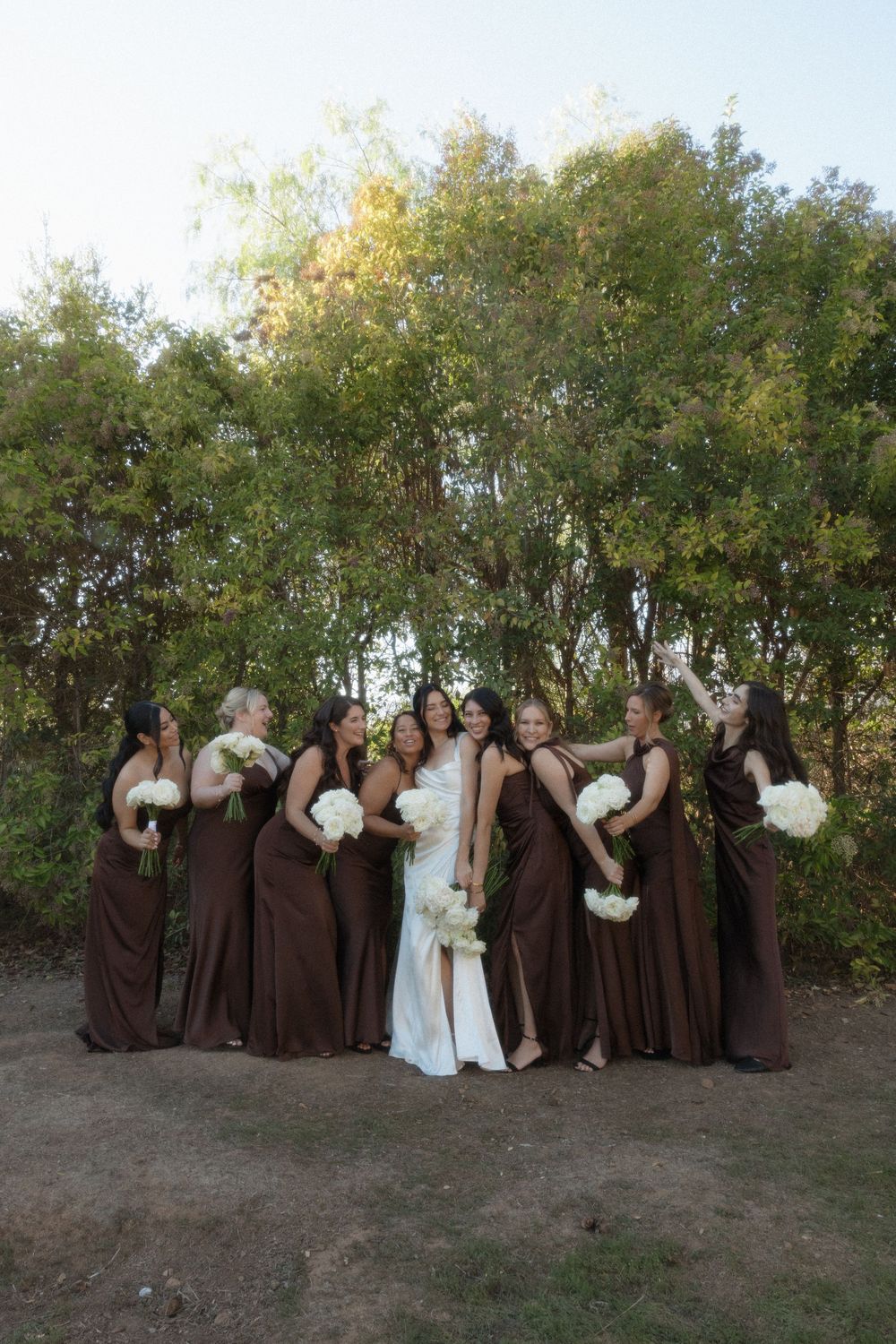 Wedding party in brown and white dresses poses together outdoors in a fun candid sequence of three photos.