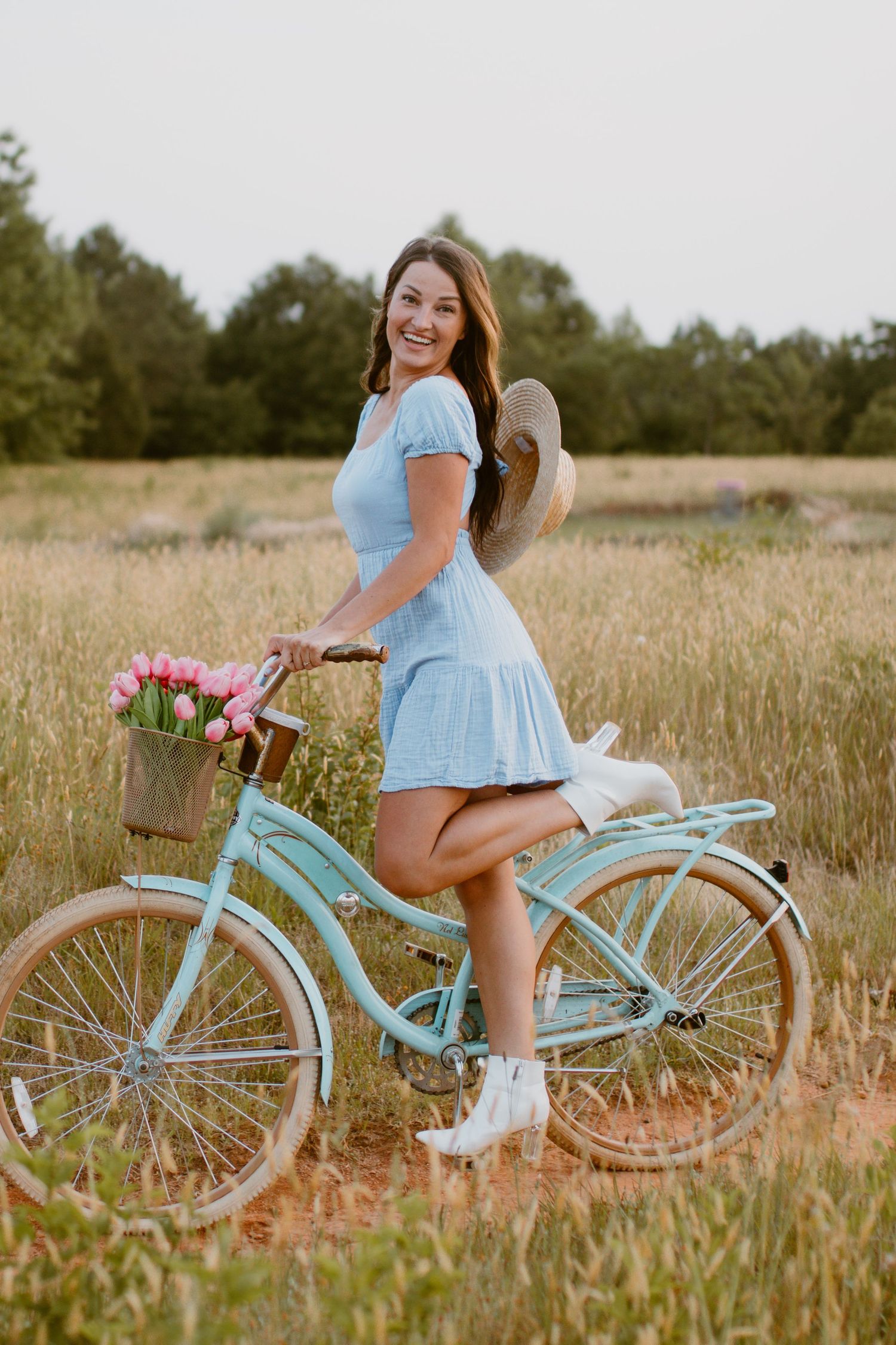 Inman Portrait Photographer spring photoshoot in field with bike and flowers