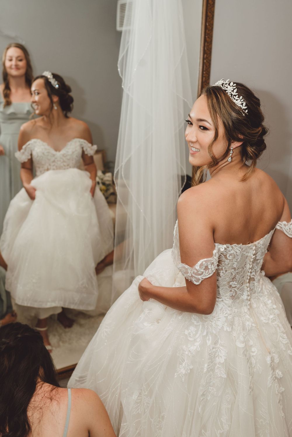 A collage of wedding dress details showing lace, tulle, and off-shoulder designs in white and ivory tones.
