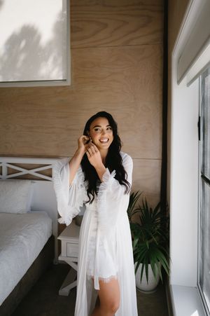 A series of boudoir photos showing a woman in white lingerie posing playfully in a bright interior setting.