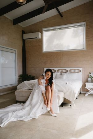 Modern bridal boudoir photoshoot with natural lighting and clean aesthetic.