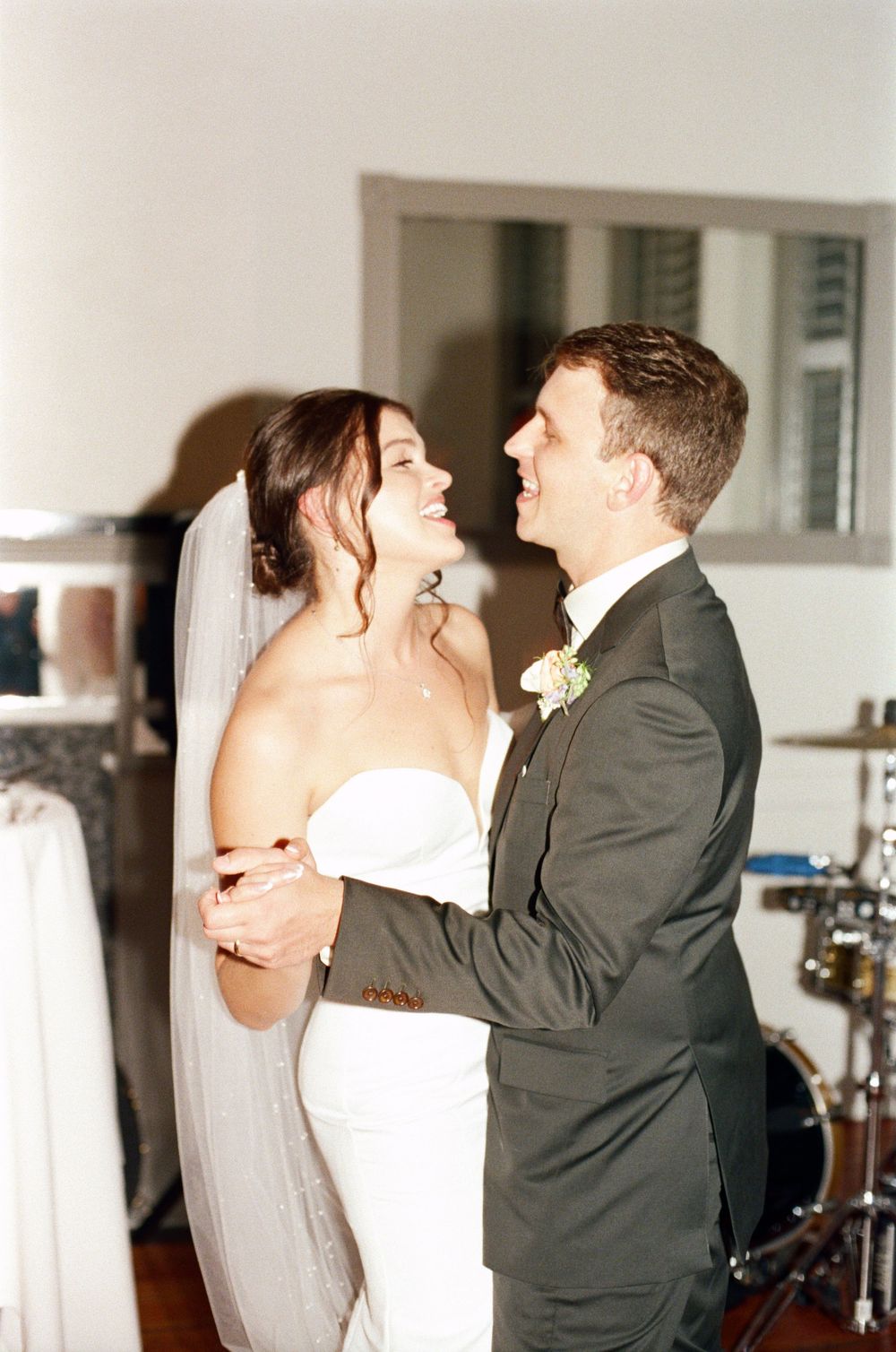 A sequence of romantic wedding dance moments captured in an indoor setting.