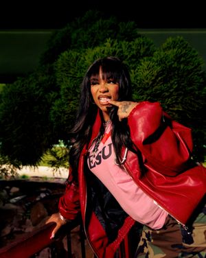 A figure in a pink and red outfit poses dramatically against a dark background in a series of connected shots.