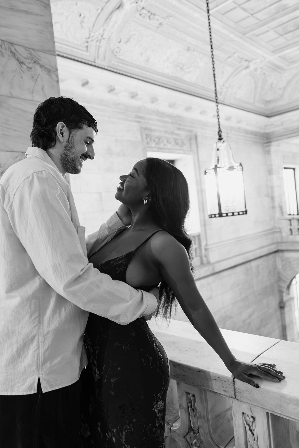 Black and white images depicting a dramatic dance performance between two people in an ornate interior.