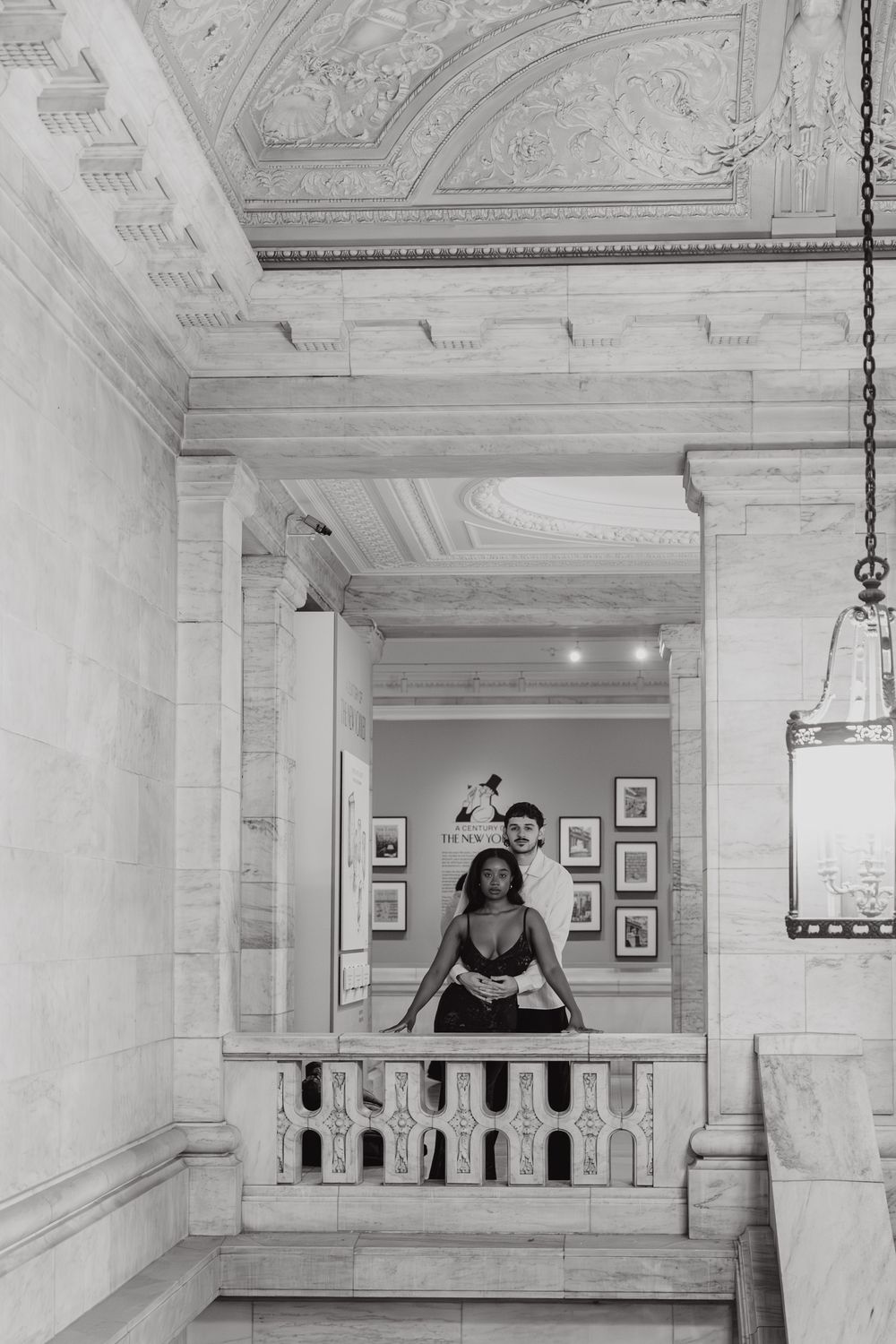 A series of black and white photos showing a person moving across a balcony in a classical building.