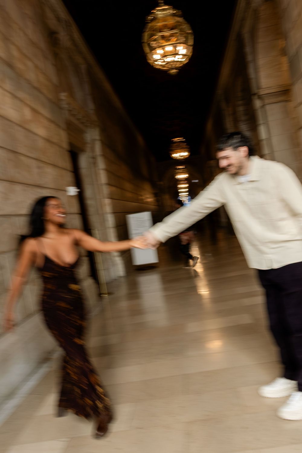 A series of motion-blurred dance photos showing two people spinning in an elegant ballroom with ornate lighting.