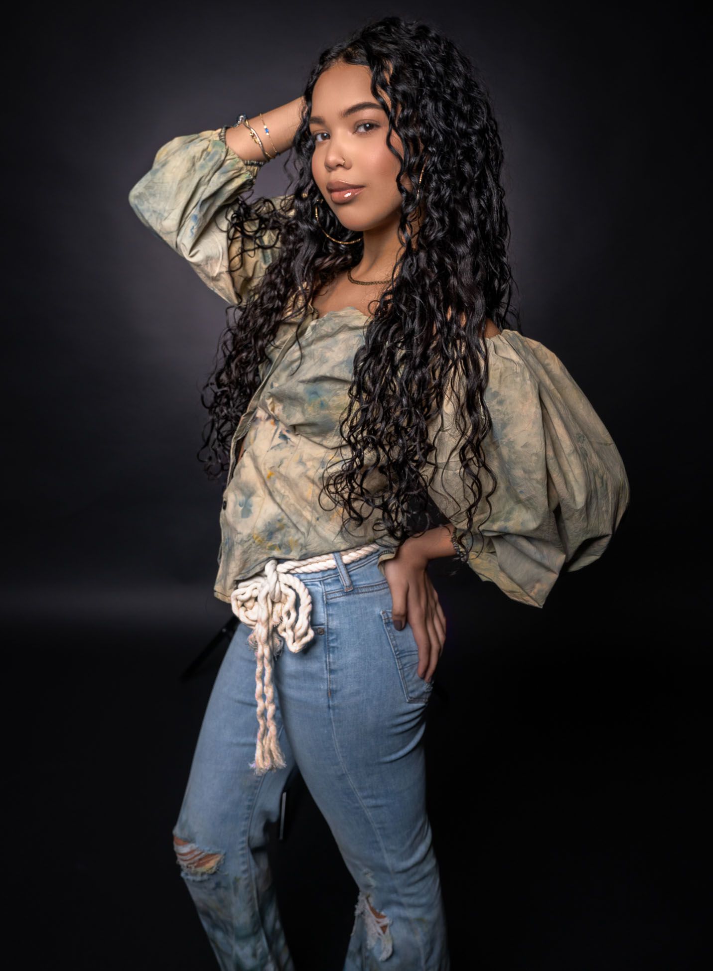 Charleston studio senior portrait of high school senior with dramatic lighting and casual outfit