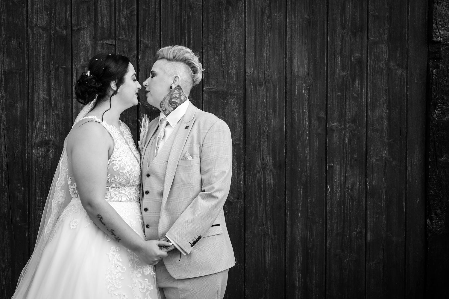 A black and white photo of a wedding couple at Plough Inn, Eaton, by Michael Pardoe, Cheshire wedding photographer.