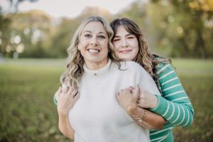 Candid family moments captured in a natural outdoor setting during golden hour.