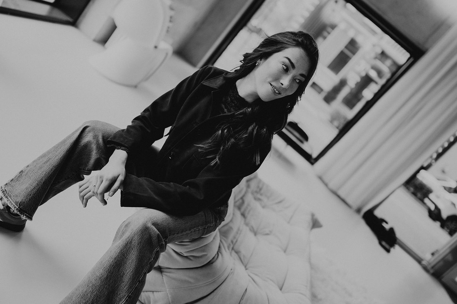 Series of monochrome photos capturing relaxed poses in an indoor setting.