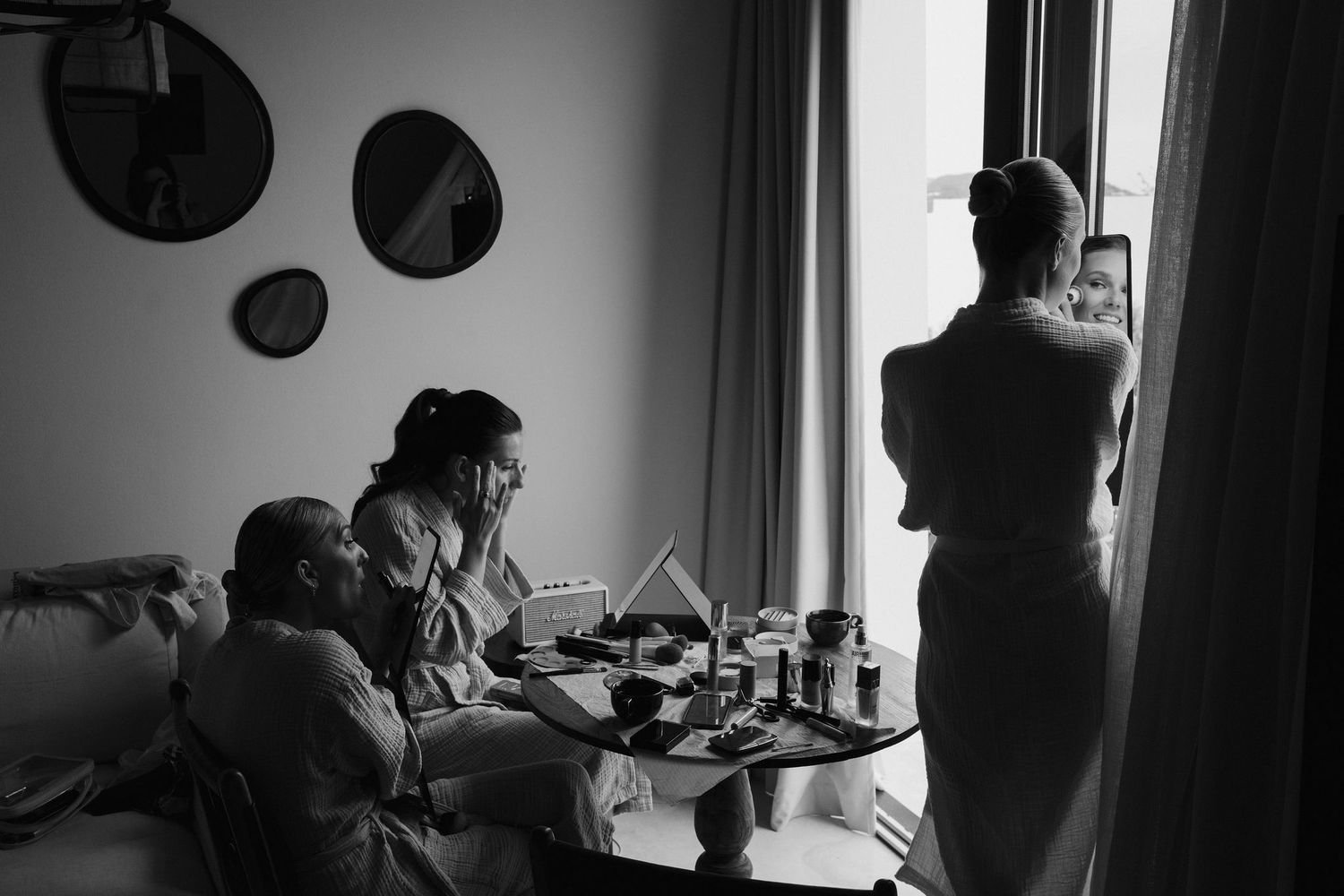 bride and bridesmaids applying makeup at casa maca ibiza