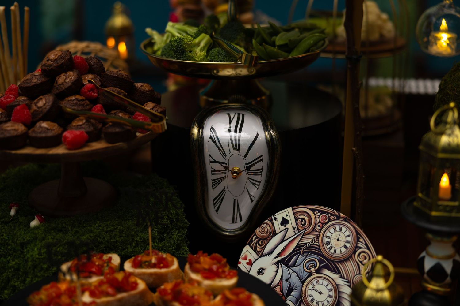 Festive holiday table setting with candles, clocks, and red berries creating an elegant Christmas atmosphere.