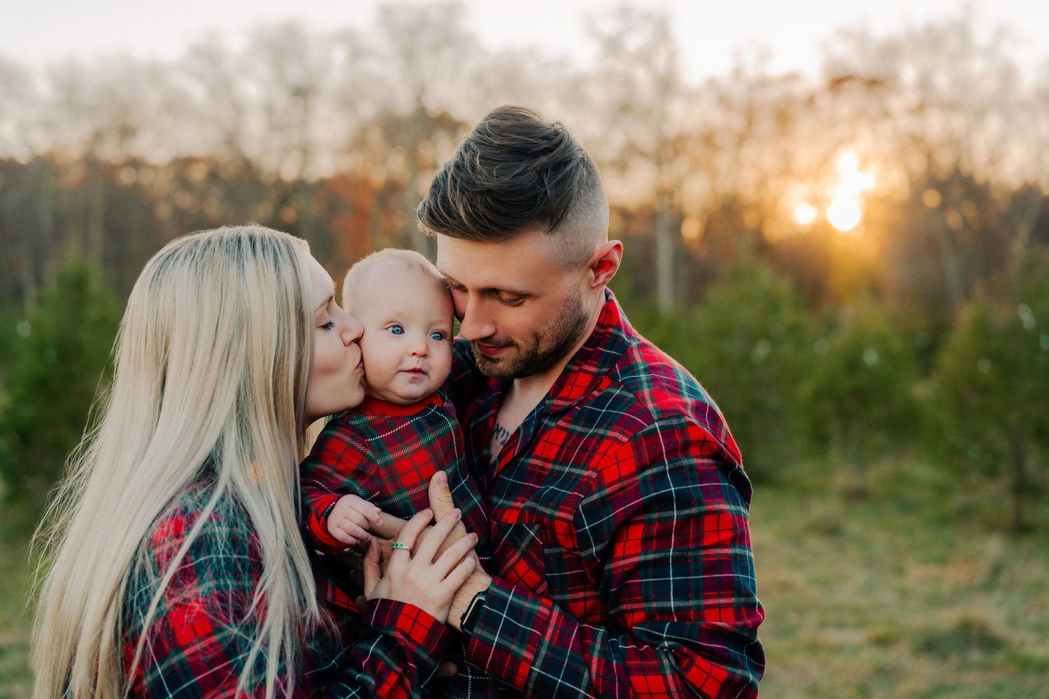 Mom and Dad Holding Toddler Son