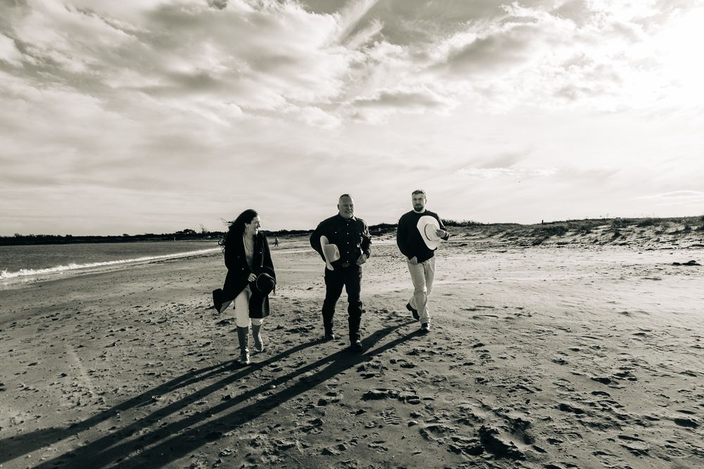 Black and White family photo on the beach.