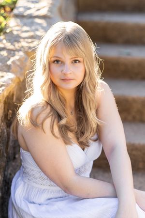 Outdoor portrait series of a person in a white lace dress with blonde hair against a sunlit natural backdrop.