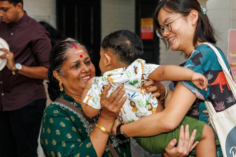 A joyful moment shared between family members at a celebration.