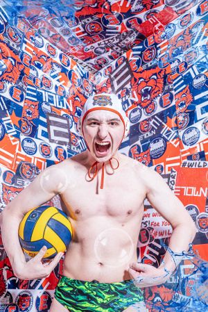 Athletic figure holding volleyball against vibrant red and blue sports-themed wallpaper background.