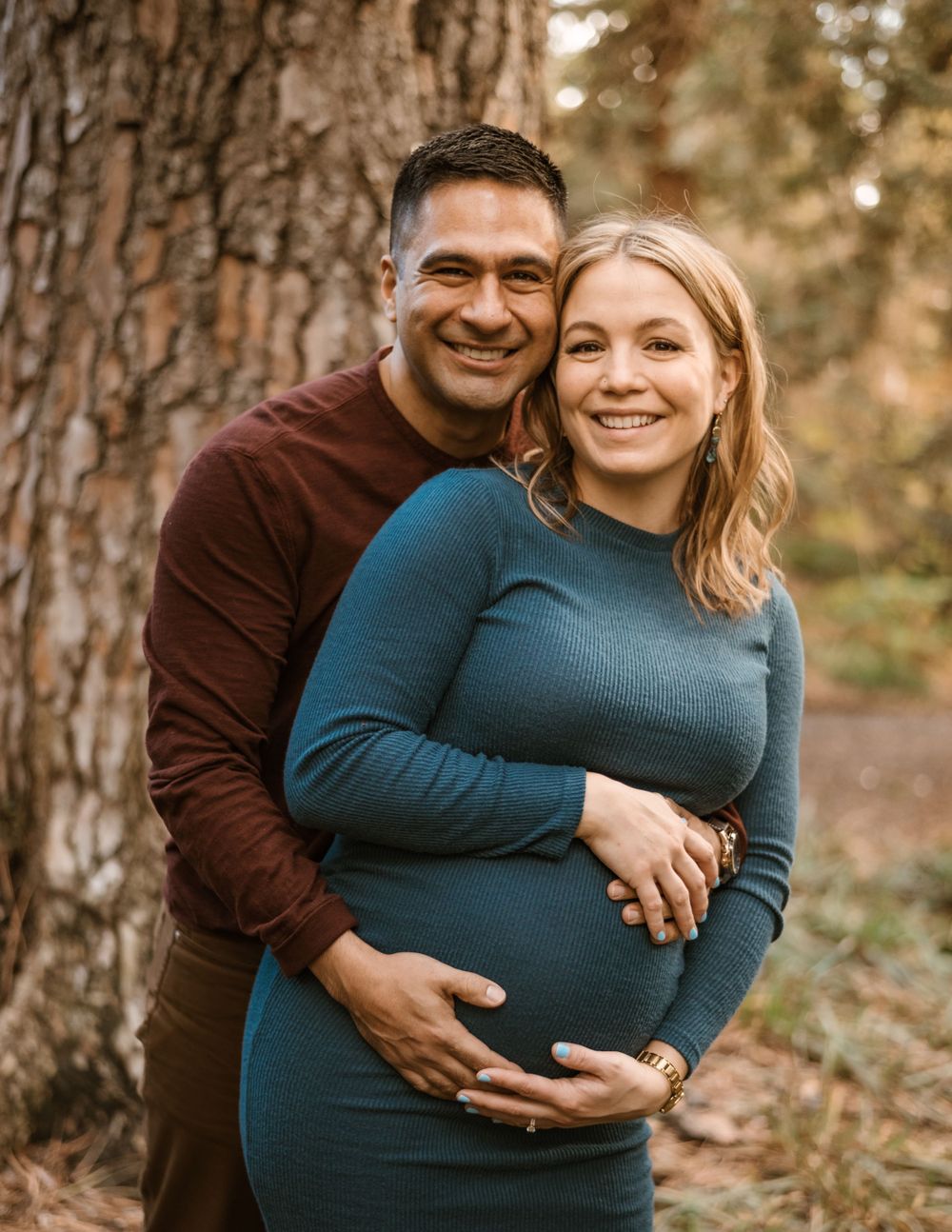 Sweet maternity moments captured in a series of forest photos at sunset.