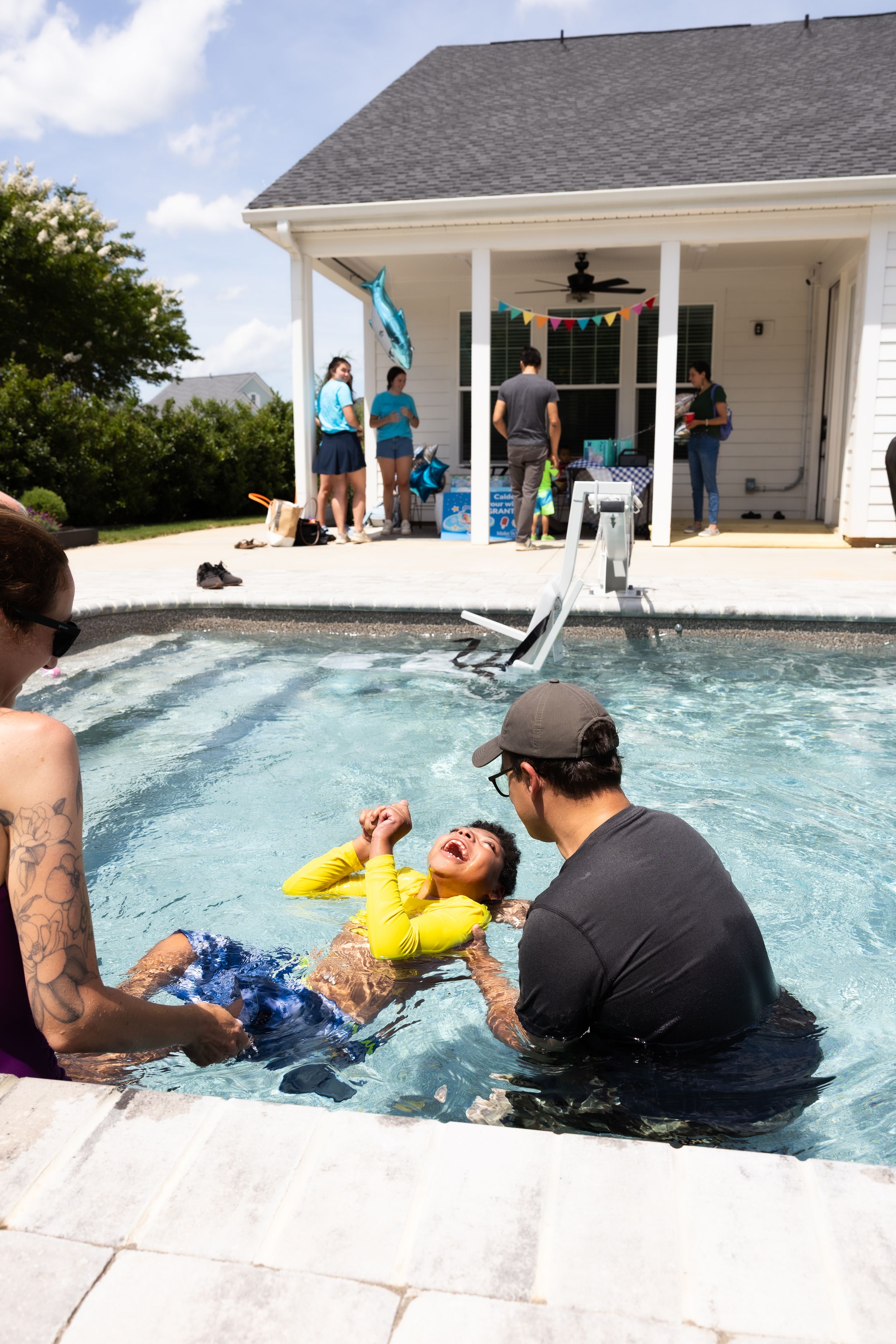 Guests enjoying a lively pool party during an event photography session in Greenville, SC.
