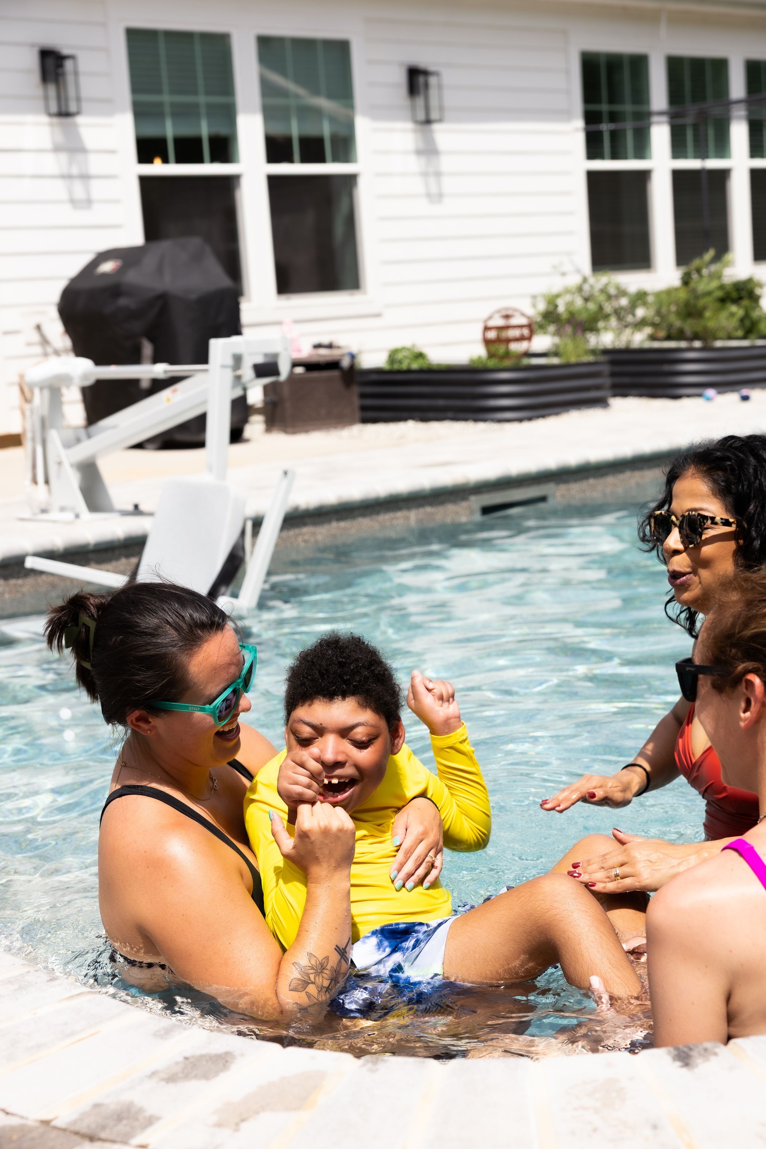 Guests enjoying a lively pool party during an event photography session in Greenville, SC.
