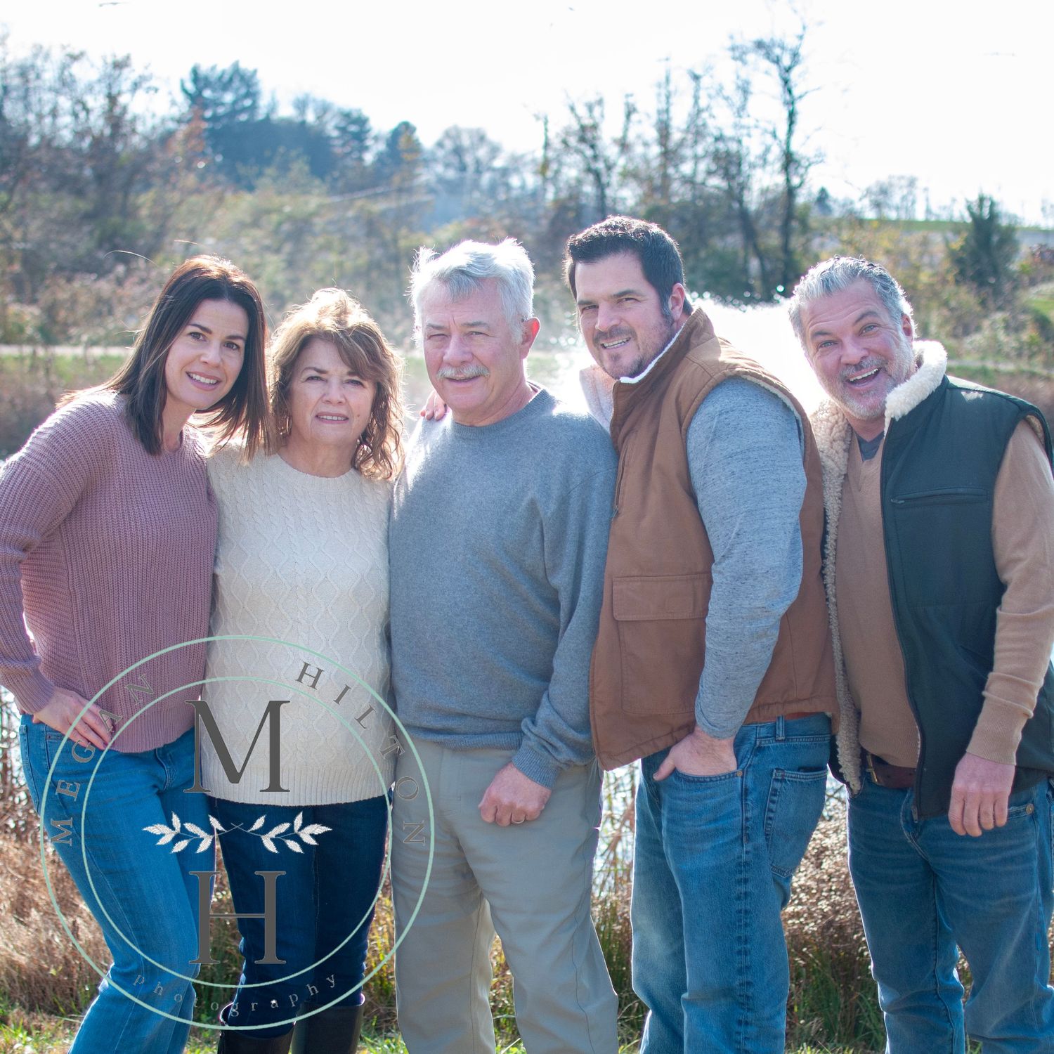 Parents with adult children outside photo