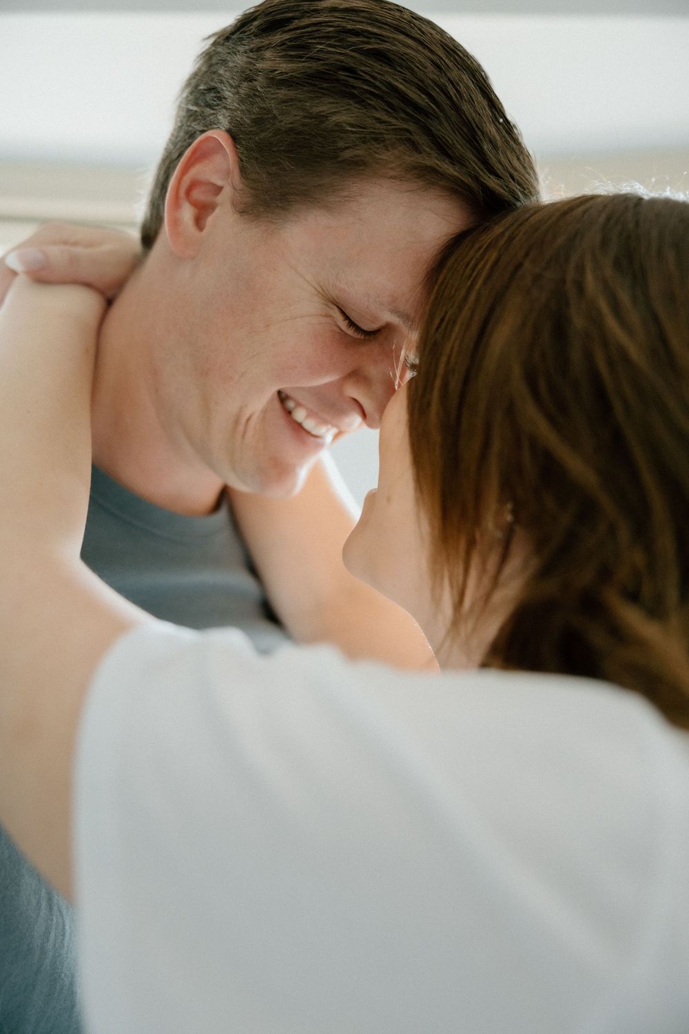 An intimate close-up of a couple sharing a tender moment together.